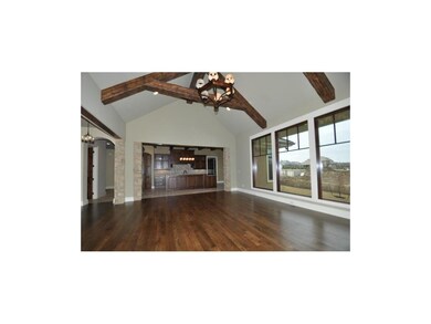 Family Rm wood floors & open to Kitchen area w/til