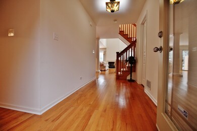 Spacious Foyer w/Gleaming Hardwood Floors