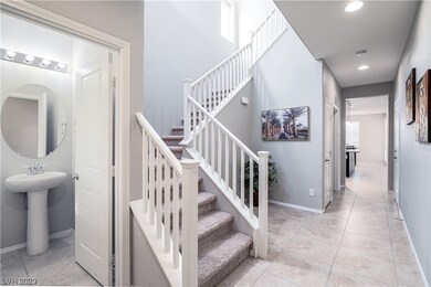Entry hallway and stairs with alcove