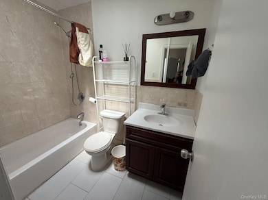 Bathroom with shower / bathtub combination and vanity