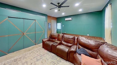 Cinema room featuring a ceiling fan and recessed lighting