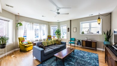 living room with giant bay of windows and great na