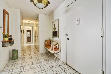 Foyer & hallway with many closets