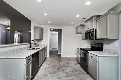 Kitchen leads off garage