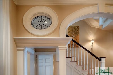 One of a pair of leaded glass oculus window detail