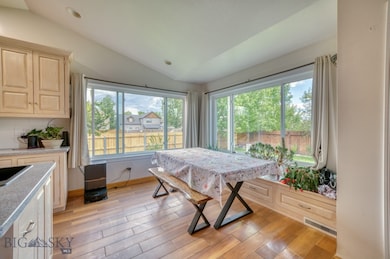 Dining area with large windows looking to the back