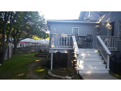 Exterior Back. Nice back deck which is accessed of