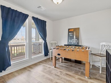 Rec room with hardwood / wood-style floors