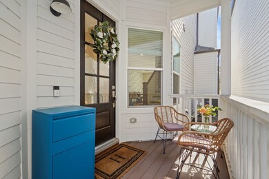 Large front porch behind privacy fence