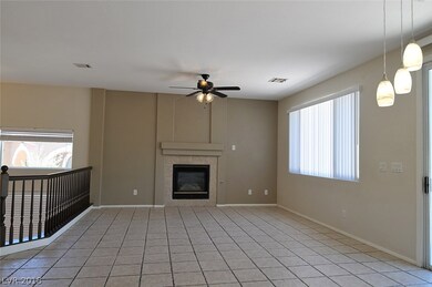 Large upstairs living area with fireplace, ceiling