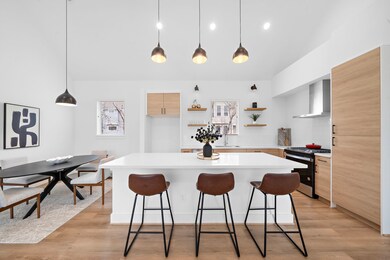 Modern kitchen features a spacious island with sea
