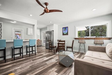 Open and airy living room /kitchen at the back of the home