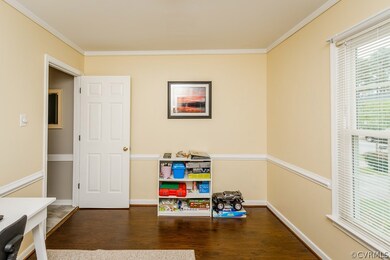 Dining room or Office with fresh paint and dark fl