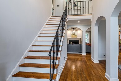 Hardwood entry looking towards greatroom with Fire