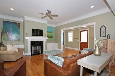 Great Room features built-in cabinets and gas log 