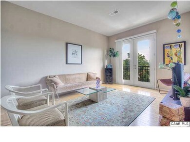 The living room is awash in daylight from the Fren