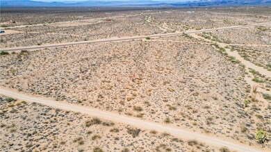 Aerial view of sparsely populated area with a moun