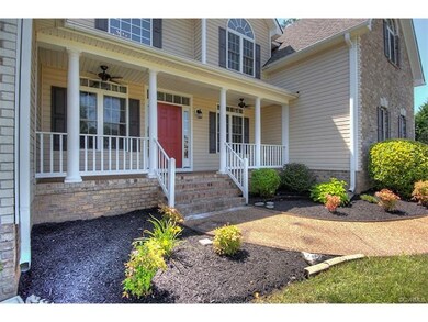 Nicely landscaped and cozy front porch with ceilin