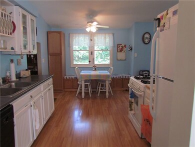The kitchen has been updated and has a great bench