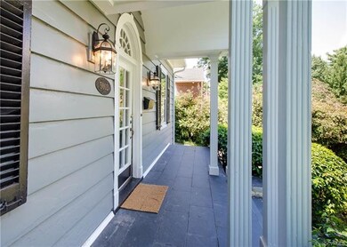 The front porch is warm and inviting with new porc