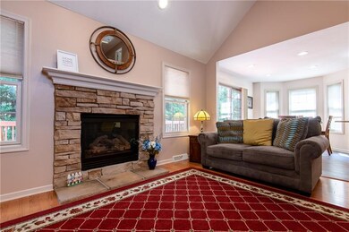 The gas fireplace is the focal point of the living room, which opens to the dining room and the large eat in kitchen.
