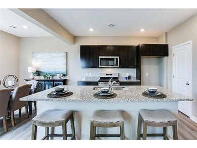 Granite counters, beautiful cabinets, and open spaces! *Model photo, selections and colors may vary!