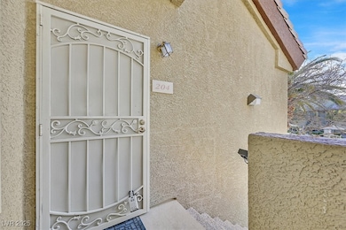 View of exterior entry with stucco siding