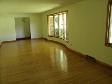 LARGE LIVING ROOM WITH HARDWOOD FLOORS