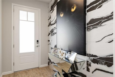 Entryway door provides privacy but allows light to enter the home