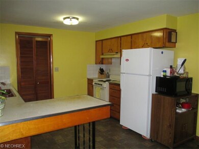 Natural wood cabinetry. Newer refrigerator stays a