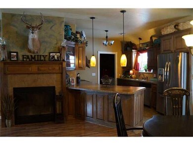 Living Room. Beautiful wood burning fireplace.