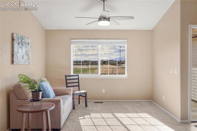 Formal living room with vaulted ceilings and views