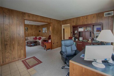 Den/ office/ playroom open to family room and kitc