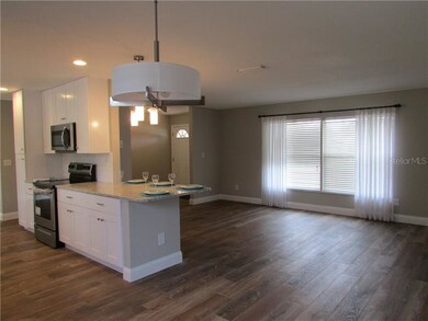 Dining room view to the living room and foyer
