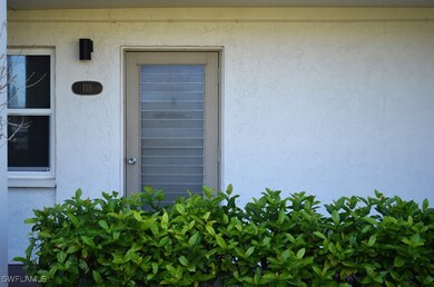 Entrance to property featuring stucco siding
