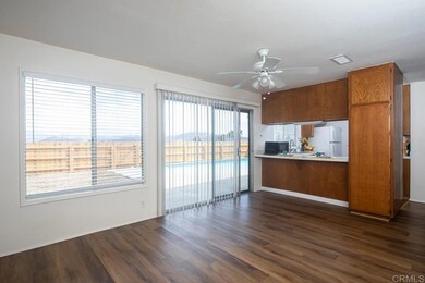 With view to breakfast bar and kitchen.