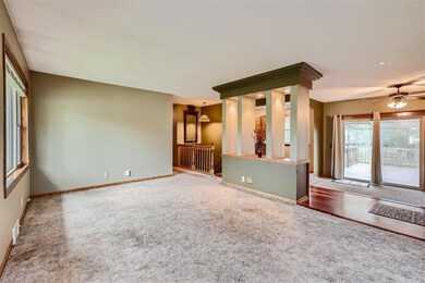 Living room view looking into kitchen and dining area