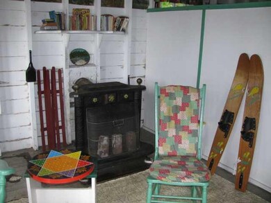 Living Room. Franklin wood stove to...