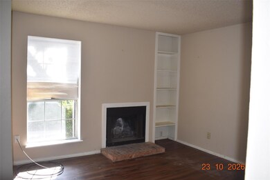 Unfurnished living room with dark wood-type floori