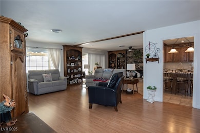 Living room with light wood finished floors and a