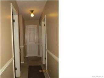 Hallway on the opposite side of home leading to an