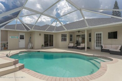 Outdoor pool with an outdoor hangout area, a patio area, a lanai, a sunroom, and ceiling fan