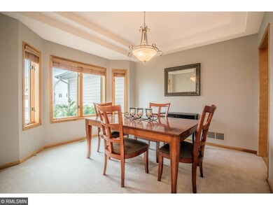 Formal dining room highlights double recessed ceil