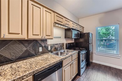 Kitchen featuring stainless steel appliances, cre