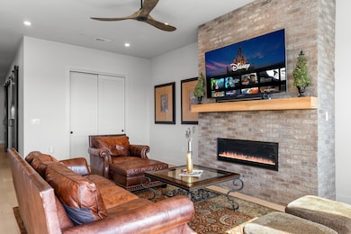 Living area with wood finished floors, a ceiling 