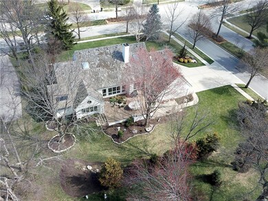 Perfectly sited on a corner lot with lush landscap