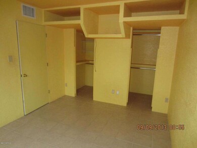 Bedroom with built in shelving