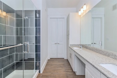Spacious bathroom with double sinks, walk-in showe