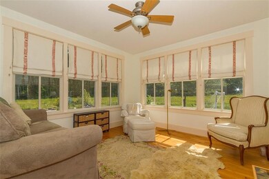 Sunroom with views of fields