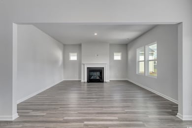 Unfurnished living room featuring a fireplace with